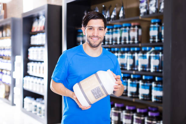 istock sport man looking different sport nutrition products 1069803076