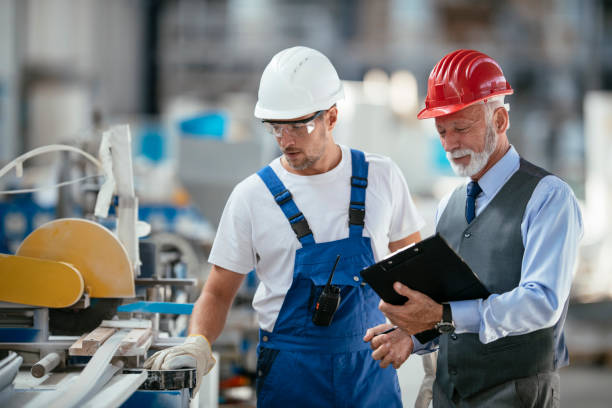 istock Quality inspector and manual worker in a factory 1069804882