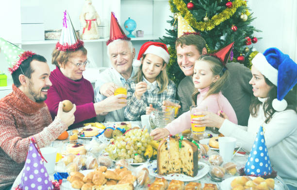 istock Large family eating Christmas dinner 1069807036
