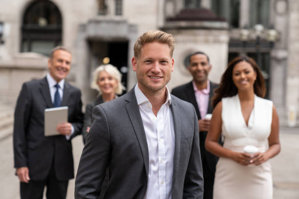 istock Successful man leading a business group 1069818212