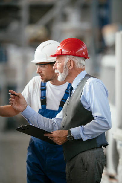 istock Quality inspector and manual worker in a factory 1069821462