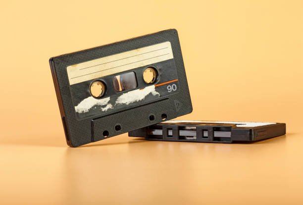 istock Two vintage audio cassette on brown background 1069837002