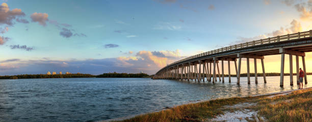 istock Sunset over Bridge along Estero Boulevard, crossing over New Pass from Estero Bay in Bonita Springs 1069842526