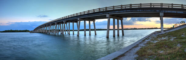 istock Sunset over Bridge along Estero Boulevard, crossing over New Pass from Estero Bay in Bonita Springs 1069842610