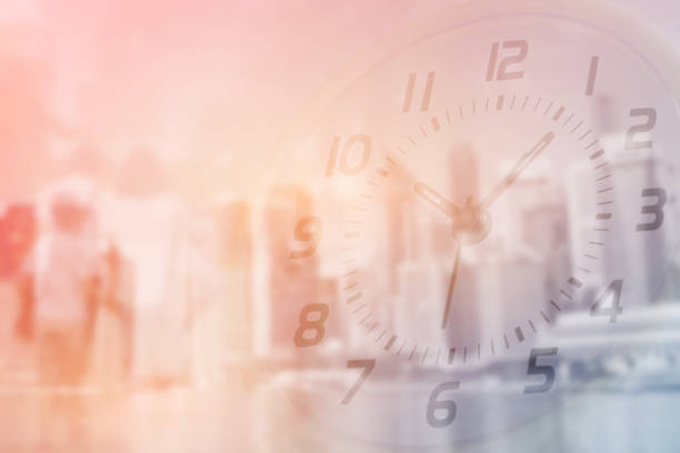 istock Double exposure of clock and people walking with blurred building 1069844572