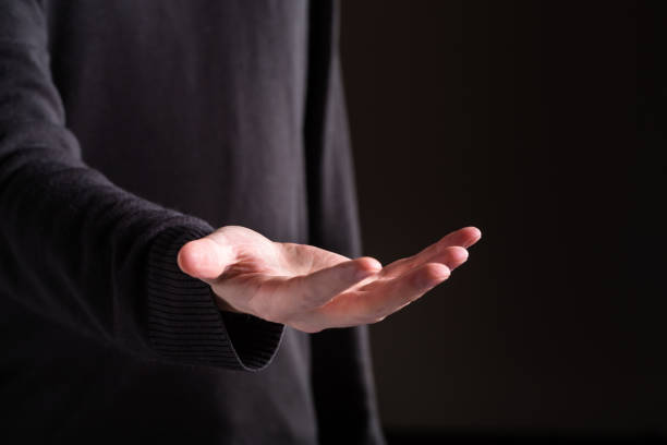 istock Man holding his hand and showing something 1069845940