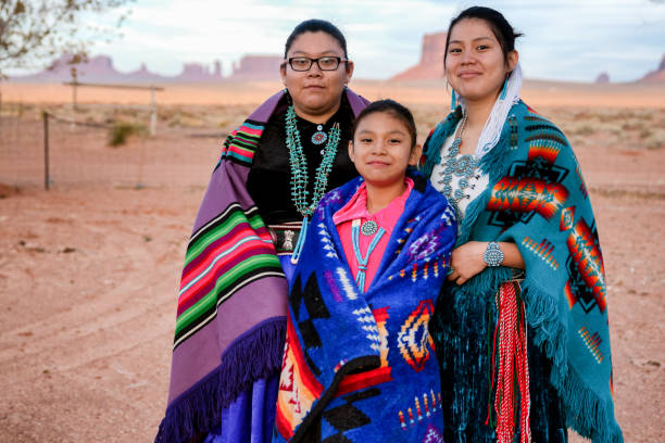 istock Three Young Navajo Sisters in Monument Valley Arizona 1069847714