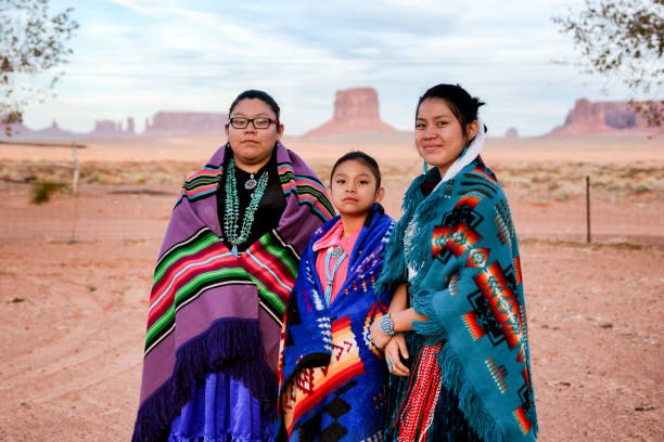 istock Three Young Navajo Sisters in Monument Valley Arizona 1069847722
