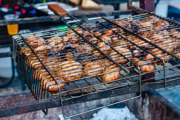 istock Champignons preparing in a barbecue grill on picnic 1069848352