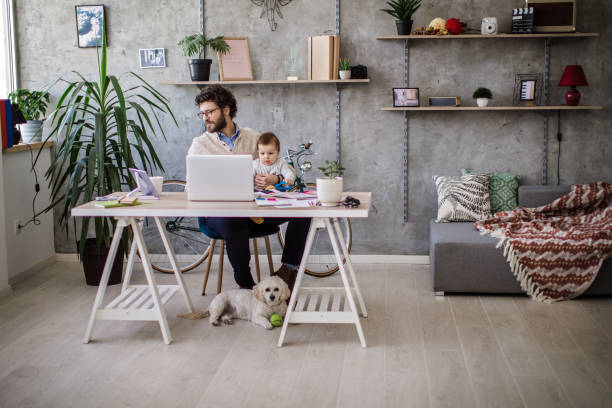 Father And Baby in home office