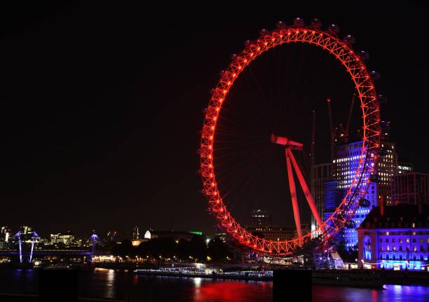 London, England - October 19, 2018: The London Eye (also known as the Millennium Wheel), a massive ferris wheel on the south bank of the River Thames.