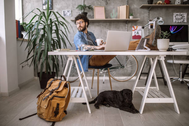 istock Busy Young Freelancer at home office 1069858924
