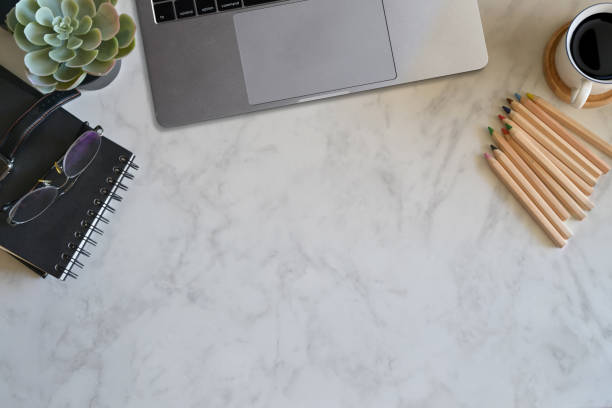 istock Marble top table with office supplies and copy space. 1069863616