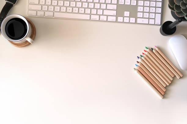 istock Top view wood workspace with keyboard computer and office accessories, Workspace and copy space 1069863760