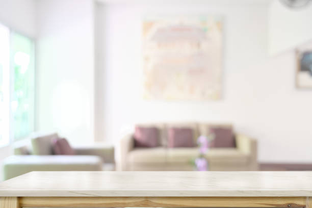 istock Marble table top over blurred living room background 1069863840