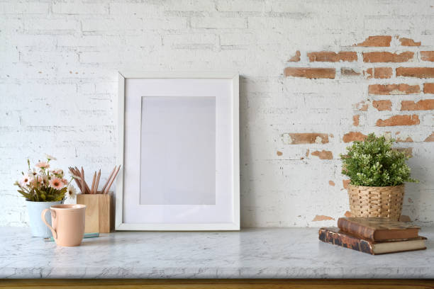 istock Mockup blank poster with house plant over white brick wall. 1069864070