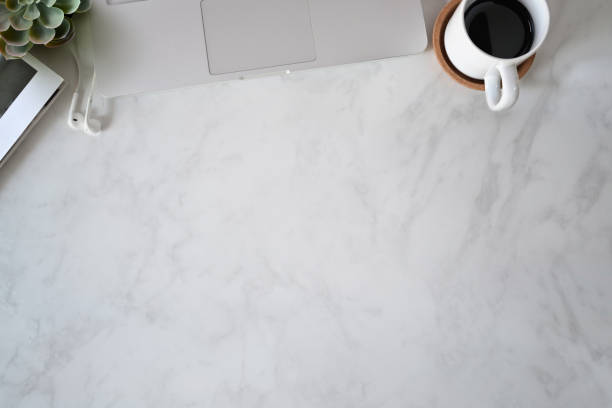 istock Top view marble office desktop with office supplies and copy space 1069866204