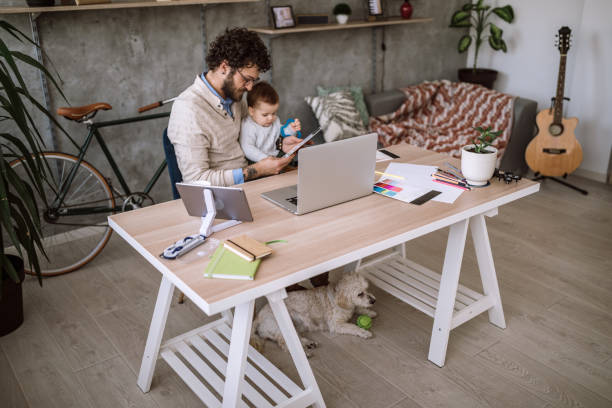 istock Father And Baby in home office 1069867390