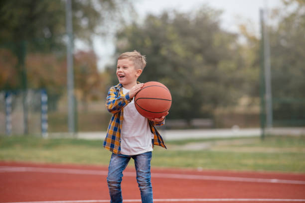 istock Happy family playing basketball 1069868152