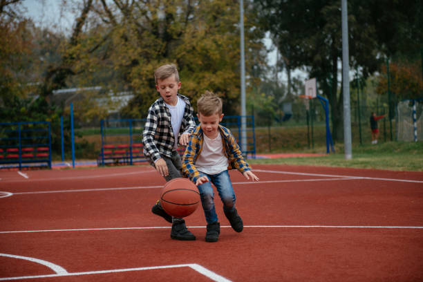 istock Happy family playing basketball 1069873618