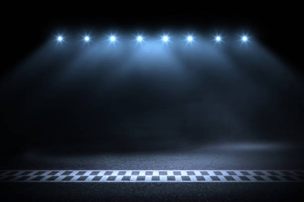 istock Race track finish line racing on night 1069876108