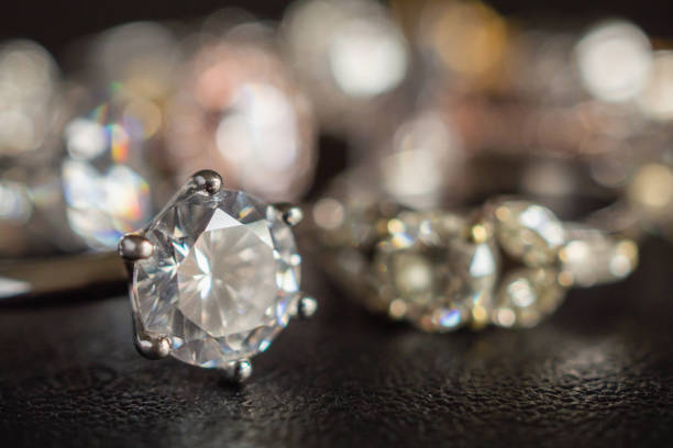 istock Jewelry diamond rings set on black background close up 1069877764