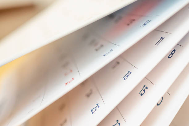 istock Abstract blur calendar page flipping sheet close up background 1069877780