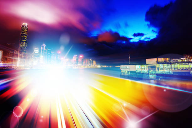 istock Abstract Light trails background with Hong Kong City scraper. double exposure 1069877814