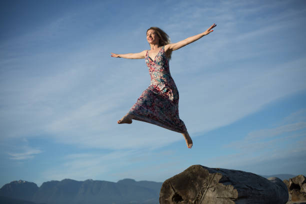 istock Winning attitude young woman flying sky 1069878046