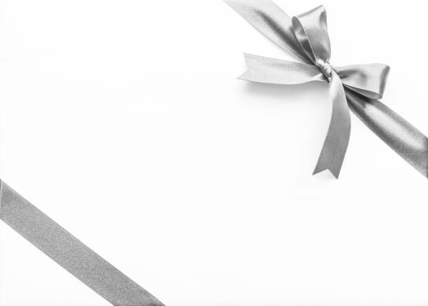 istock Silver pearl satin ribbon stripe corner fabric bow isolated on white background with clipping path 1069878166