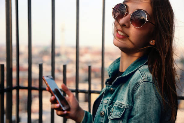 istock Beautiful woman Taking Photos 1069878180