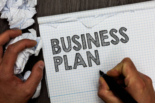 istock Word writing text Business Plan. Business concept for Structural Strategy Goals and Objectives Financial Projections Man holding marker notebook crumpled papers several tries mistakes made. 1069879394