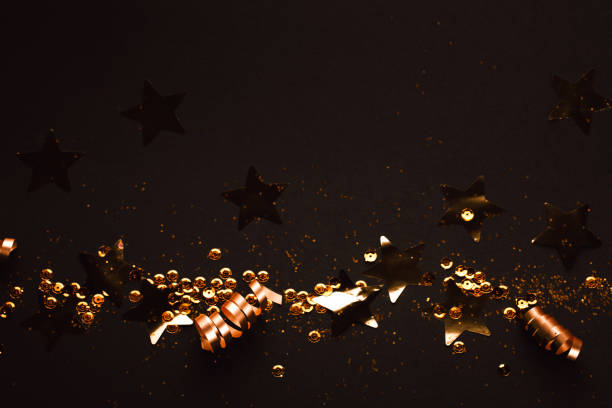 istock Golden stylish decoration on black background. Place for text. 1069879698