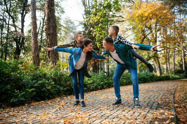 istock Happy family in the park 1069881184