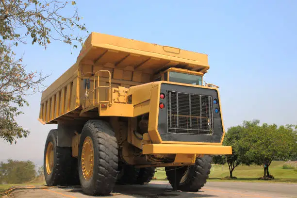 Heavy mining truck in mine and driving along the opencast. Photo of the big mine truck, The career heavy-load super car.