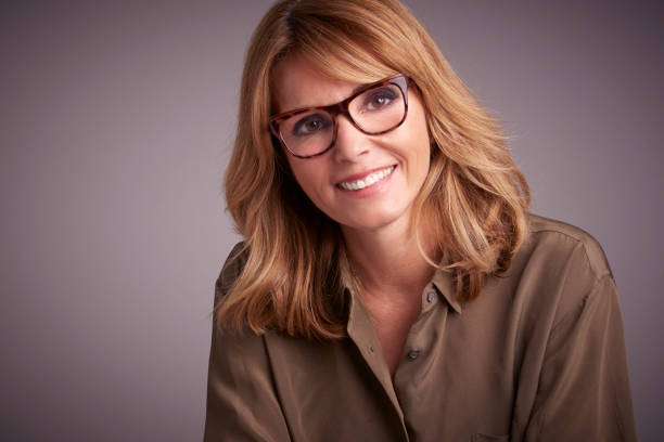 istock Middle aged woman studio portrait 1069882188