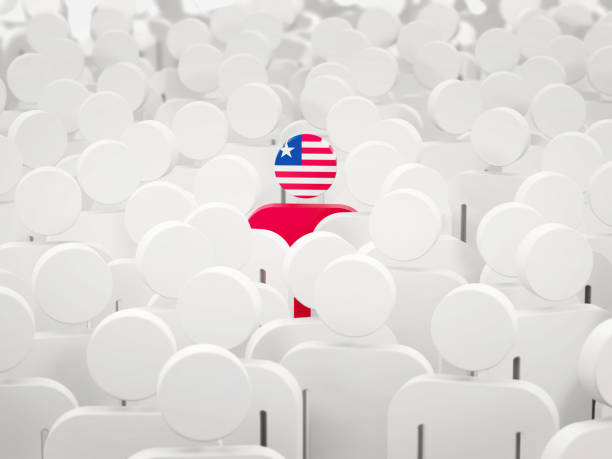 istock Man with flag of liberia in a crowd 1069883608