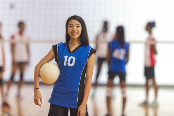istock Woman with volleyball 1069890736