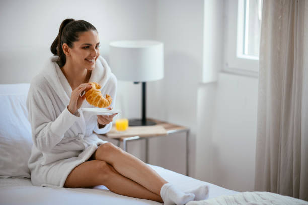 istock Young women having croissant 1069891244