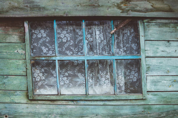 istock Old rustic wooden window in countryside house 1069891284