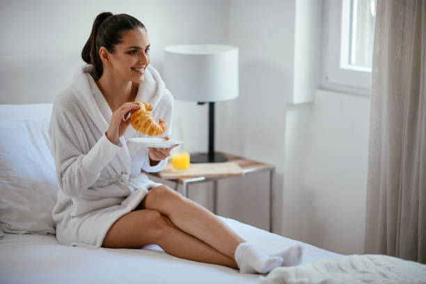 istock Young women having croissant 1069892726