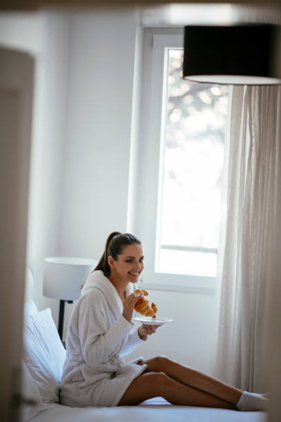 istock Young women having croissant 1069893460