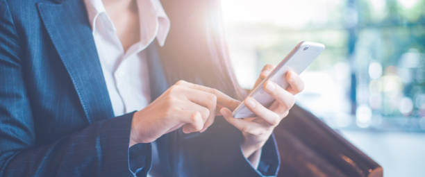 istock Business women hand are uses a smartphone in office. 1069893530