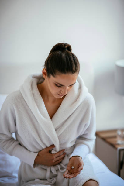 istock Woman with a stomach ache 1069895570