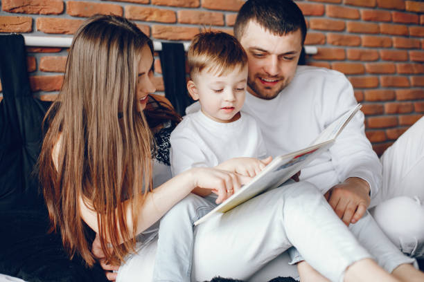 istock Family sitting in a bed 1069897034