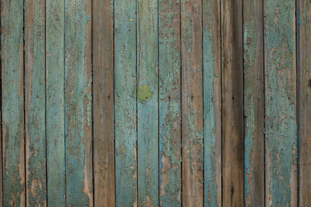istock old turquoise dilapidated wooden fence 1069897444