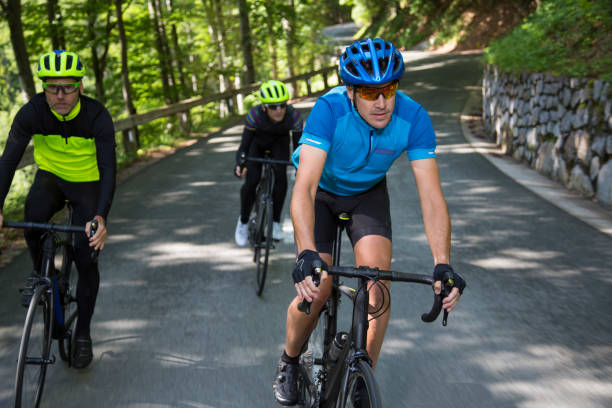 istock Three men riding road bikes on mountain road 1069897618