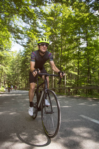 istock Man riding road bikes on mountain road 1069897654
