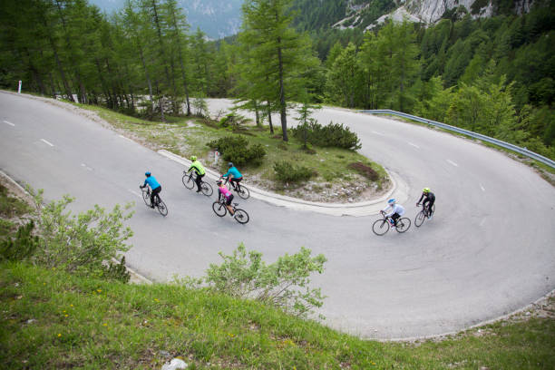 istock Group of road cyclists riding up mountain road 1069897688