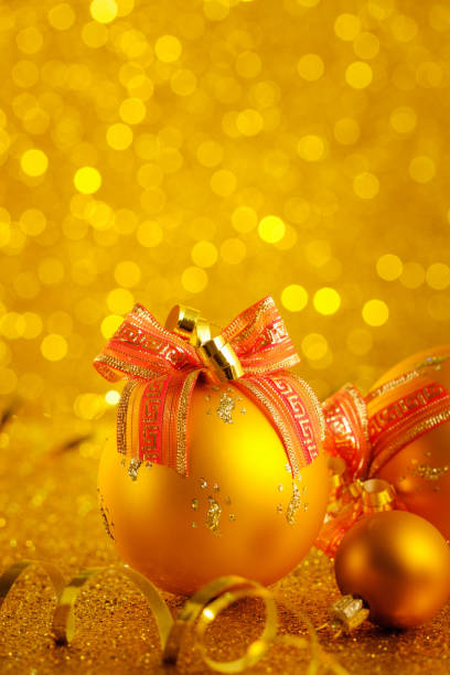 istock Gold Christmas balls on a gold background 1069900226